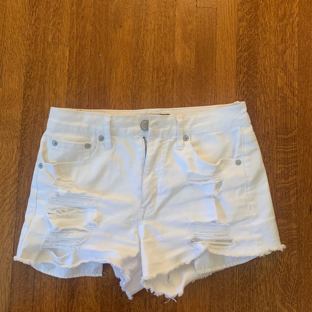 White denim shorts with rips